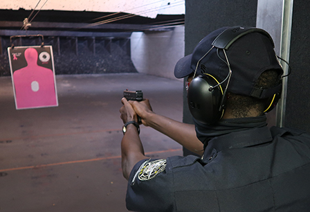 security guard practicing at shooting range